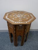 AN EASTERN INLAID OCTAGONAL TOP TABLE, multi-wood and mother of pearl inlaid, geometric and scroll