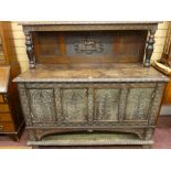 A GEORGE III AND LATER JACOBEAN STYLE SIDEBOARD, pollard and mixed period oak having a carved
