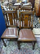 A SET OF FOUR HIGHBACK OAK BARLEY TWIST DINING CHAIRS with carved rail and central splat with drop-
