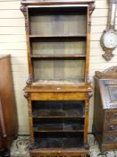 A VICTORIAN FIGURED WALNUT TWO TIER OPEN BOOKCASE, the upper section with pierced fretwork rail