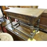 A VICTORIAN OAK BOX SEAT STOOL, the top with cleated ends on a peg joined base, on turned and