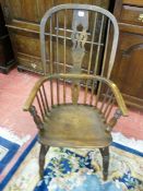 AN EARLY 19th CENTURY OAK WINDSOR ARMCHAIR with pierced double splatback on turned supports with 'H'