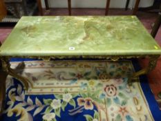 A BRASS AND ONYX EFFECT COFFEE TABLE, 41 cms high, 91 cms wide