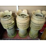 THREE SANDSTONE COLOURED CHIMNEY POTS, 92 cms high, (some losses and cracks)