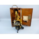 A CASED SCIENTIFIC MICROSCOPE by E Leitz Wetzlar, no. 62222, black japanned and brass lacquered,