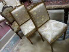A PAIR OF FRENCH STYLE GILT BEDROOM CHAIRS in a satin floral upholstery and a French walnut armchair