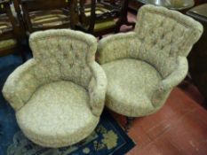 A PAIR OF EDWARDIAN BUTTON UPHOLSTERED SALON TUB CHAIRS, circular seated with floral fabric on