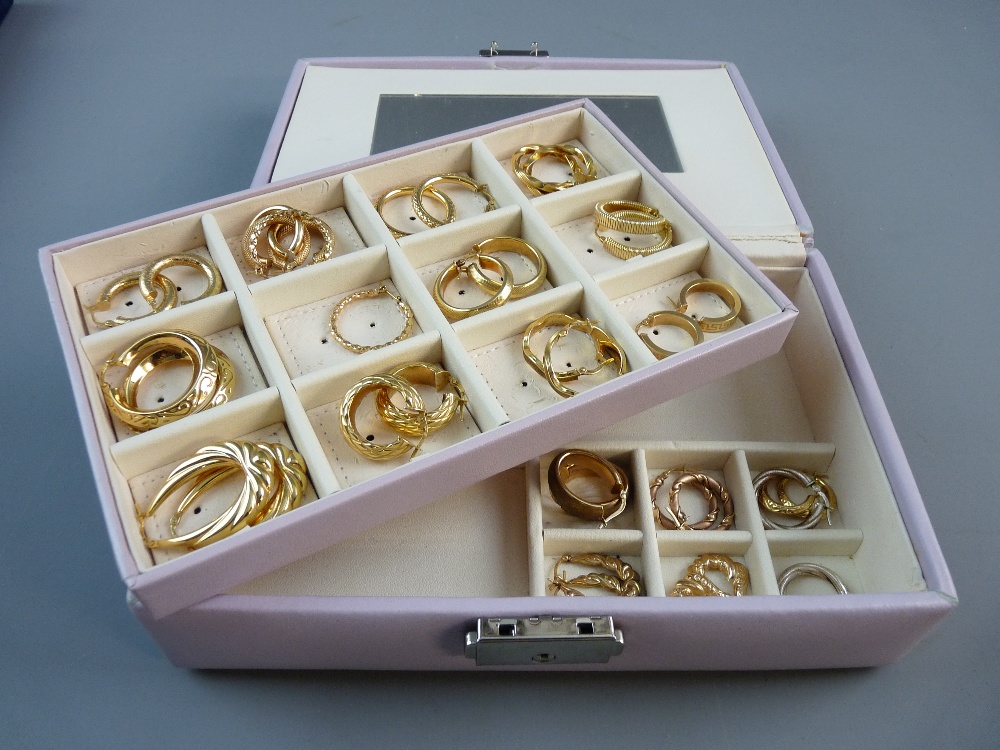 EIGHTEEN PAIRS OF NINE CARAT GOLD HOOP EARRINGS, 52 grms contained in a lilac jewellery box