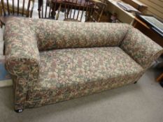 A LATE 19th/EARLY 20th CENTURY RATCHET DROP END SOFA with foldover arms on turned bun feet, 70 cms