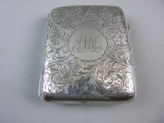 A HALLMARKED SILVER CIGARETTE CASE, chase decorated with central monogrammed cartouche, Birmingham