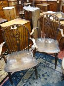 TWO 19th CENTURY ELM WHEELBACK OPEN ARMCHAIRS, 93.5 cms high the largest, 57 cms wide, (worm