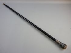 AN ANTIQUE EBONY WALKING CANE with decorative metal top, 92 cms long, the grip with crown topped