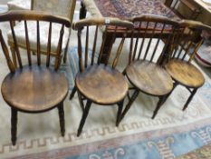 FOUR CIRCULAR SEATED SPINDLEBACK FARMHOUSE CHAIRS on turned supports with 'H' cross stretcher
