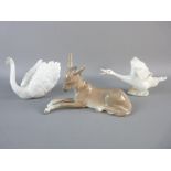 THREE LLADRO FIGURINES of a recumbent donkey, a swan model no. 6175 and a goose with outstretched