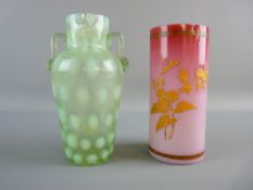 TWO VICTORIAN GLASS VASES including a vaseline twin handled example with dimple pattern and a