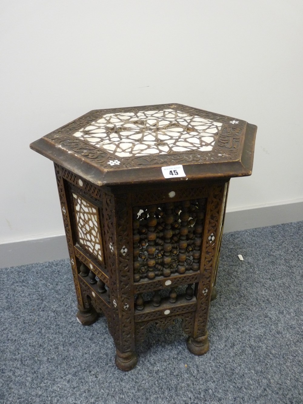 A VICTORIAN EASTERN CARVED HEXAGONAL TOPPED TABLE with mother of pearl inlay, pierced bobbin