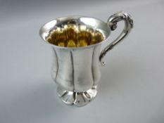 A WILLIAM IV HALLMARKED SILVER TANKARD, 12 cms high, flared segmented body and foot with scroll