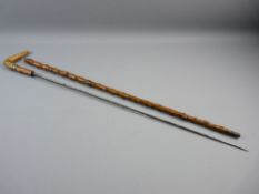 A BRIARWOOD ENCASED PULL-OUT SWORD STICK having a bone handle with small inlaid silver crest and a