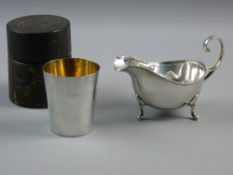 A HALLMARKED SILVER SAUCE BOAT and a sterling silver beaker, Birmingham 1937, 2.8 troy ozs, the