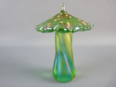 A KRIS HEATON ART GLASS TOADSTOOL in iridescent green with spot decoration, inscribed to the base 'K