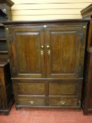 AN 18th CENTURY OAK PRESS CUPBOARD, closed top with inverted cornice and peg joined with two upper