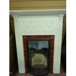 AN EDWARDIAN CAST IRON BEDROOM FIREPLACE AND SURROUND TOP MANTEL SHELF with lower bead and heart