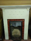 AN EDWARDIAN CAST IRON BEDROOM FIREPLACE AND SURROUND TOP MANTEL SHELF with lower bead and heart