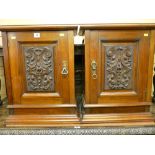 A PAIR OF EDWARDIAN MAHOGANY SINGLE DOOR WALL CABINETS with stepped cornice, central carved door