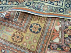 THREE EASTERN RED GROUND RUGS, all with wide borders, one with Waring & Gillow label, 191 x 131 cms,