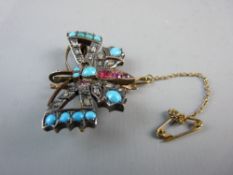 A DIAMOND, TURQUOISE AND RUBY BUTTERFLY BROOCH, 4 cms across, unmarked and untested gold set uncut