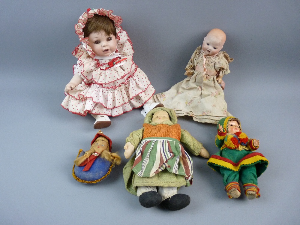AN ANTIQUE GERMAN BISQUE HEADED BABY DOLL marked KB247-1 to the rear of the head, moveable blue eyes