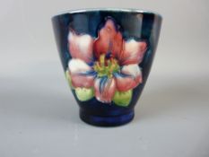 A MOORCROFT CLEMATIS CONICAL VASE, decorated on a cobalt ground, impressed 'Moorcroft, Made in