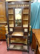AN EDWARDIAN MAHOGANY MIRRORED HALLSTAND, the galleried top over a central bevelled mirror and