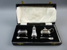 A CASED HALLMARKED SILVER THREE PIECE CONDIMENT SET with two spoons, Birmingham 1959 and later, 3.