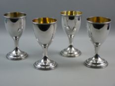 A SET OF FOUR ELECTROPLATED CHALICE STYLE GOBLETS, 9.5 cms diameter bowls on a waisted stem and
