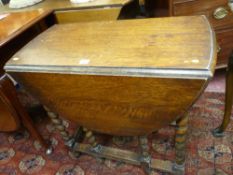 AN OAK BARLEY TWIST GATE LEG DINING TABLE, 72 x 76 cms