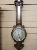 A LATE 19th CENTURY WELL CARVED OAK BANJO BAROMETER with thermometer, 84 x 34 cms
