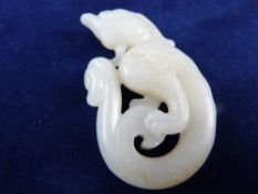 A CHINESE WHITE JADE CHI-DRAGON PENDANT, 5.5 cms long