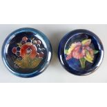 TWO MOORCROFT POMEGRANATE & ORCHID BOWLS, 11.5 cms diameter, decorations on a tonal blue and