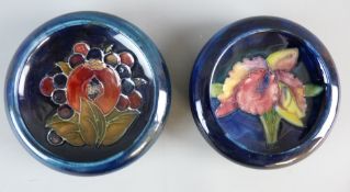 TWO MOORCROFT POMEGRANATE & ORCHID BOWLS, 11.5 cms diameter, decorations on a tonal blue and