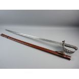 A GOOD VICTORIAN OFFICER'S CEREMONIAL SWORD having a scrolled and pierced steel basket with ray skin