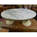 AN ITALIAN STYLE MARBLE TOP OVAL COFFEE TABLE with cream and gilt classical urn shaped base,