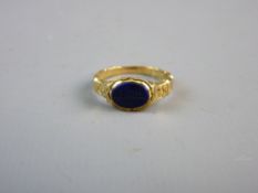 AN UNMARKED GOLD MOURNING RING with inscription and date May 1839, a blue seal on the outside and