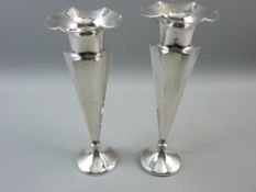 A HALLMARKED SILVER PAIR OF TRUMPET VASES with flared wavy rim collars and tubular neck, segmented