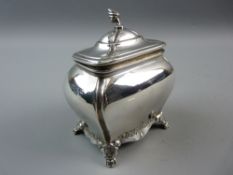 A CHESTER HALLMARKED SILVER TEA CADDY of bombe form, the lid with flame finial, chased lower