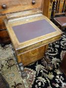 A VICTORIAN INLAID WALNUT DAVENPORT, the lidded top with multi-wood cartouche opening to reveal a