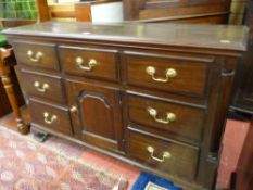 A NEAT EARLY 19th CENTURY OAK AND MAHOGANY DRESSER BASE, the moulded top over an arrangement of