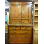 A GEORGE IV OAK AND CROSSBANDED MAHOGANY PRESS CUPBOARD having an inverted cornice over twin four