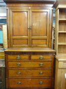 A GEORGE IV OAK AND CROSSBANDED MAHOGANY PRESS CUPBOARD having an inverted cornice over twin four