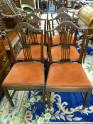 GOOD SET OF SIX COUNTRY OAK DINING CHAIRS having swept top rails with a pierced splat and